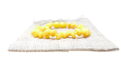 Čipsu formas olu dzeltenuma krāsas pulētā dzintara aproce bērniem