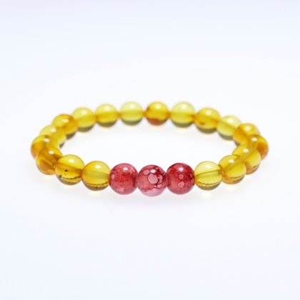 Sieviešu aproce no Citrona krāsas apstrādātā lodes formas dzinta un trīs sarkaniem Austrijas kristāliem