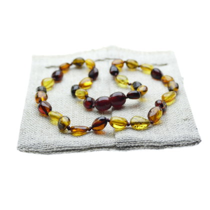 Pupiņu formas četru krāsu pulētā dzintara krelles bērniem