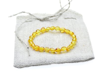 Pupiņu formas medus krāsas pulētā dzintara aproce bērniem