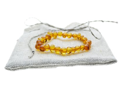 Baroka formas medus krāsas pulētā dzintara aproce bērniem