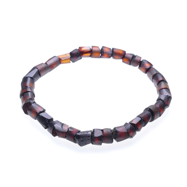 Женский браслет из тёмно-коньячного цвета неполированного янтаря в форме цилиндров
